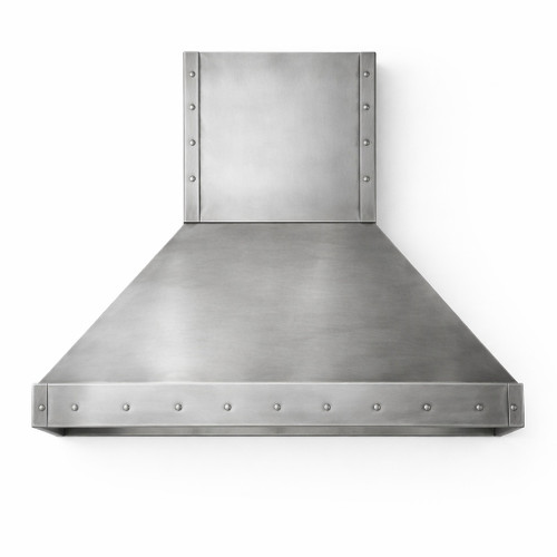 Brushed zinc range hood with rivet trim and tapered canopy featuring crisp architectural geometry, tall rectangular chimney and a wide tapered canopy