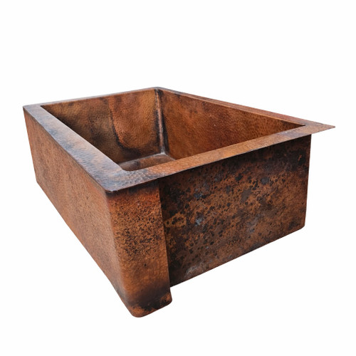 Rustic hammered copper apron-front single-bowl sink with natural patina