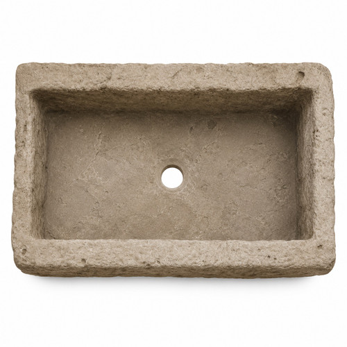 Top view of rectangular cantera stone vessel sink with centered drain hole and rustic stone texture