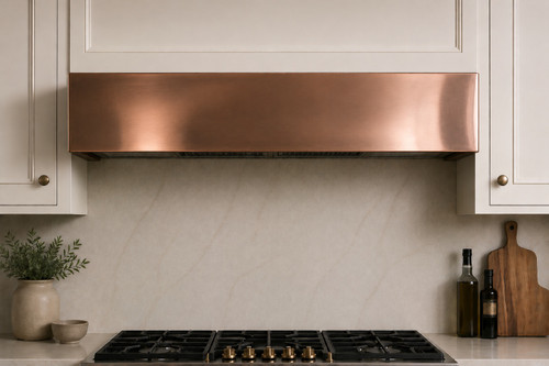 Close up of hand-polished box-shaped under-cabinet copper range hood