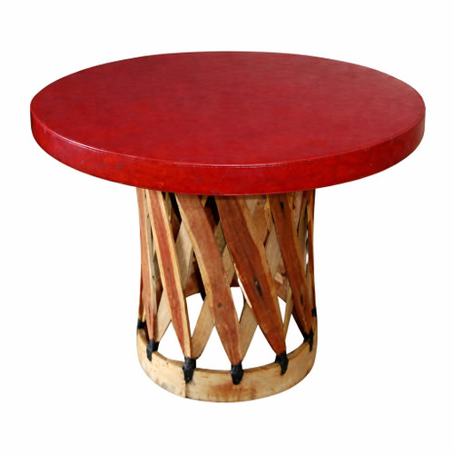 Round equipal table with a red terra cotta pigskin top