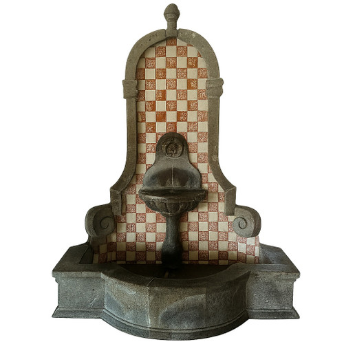 Fluted stone wall fountain with Talavera tiles