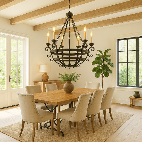 Hacienda style iron chandelier with candle lights over transitional dining table with neutral walls and wood chairs