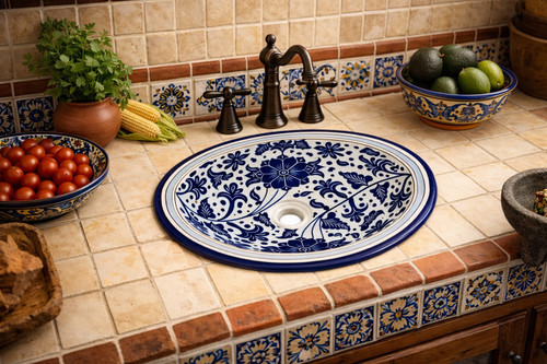 Cobalt floral talavera bathroom sink used in a kitchen setting as a decorative handcrafted focal piece