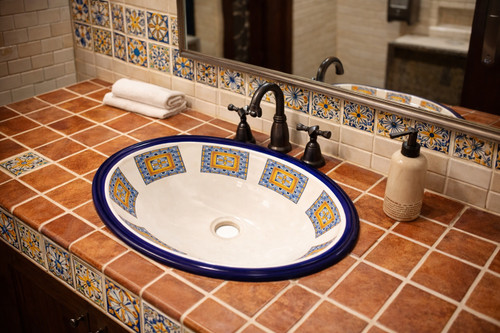 Geometric talavera bathroom sink installed in a restaurant washroom with clean lines and artisan details
