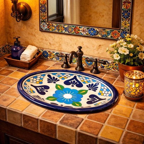 Blue floral talavera bathroom sink used in a restaurant restroom highlighting traditional Mexican ceramic style