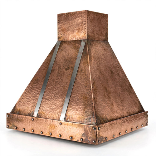 Detailed view of hammered pyramid copper hood with zinc straps showing hand hammered texture and exposed rivets on apron