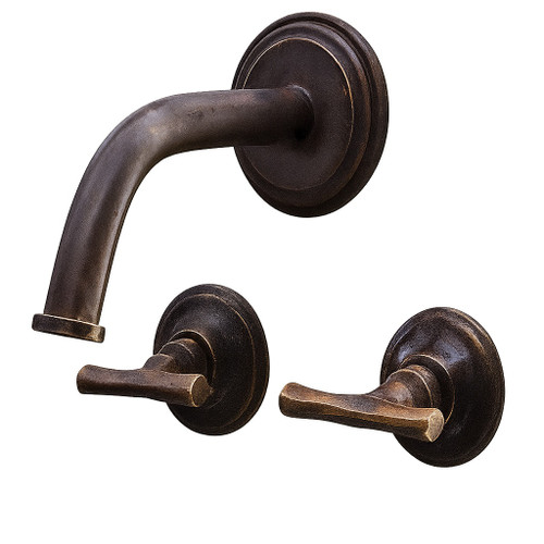 Brass wall mount faucet with two rustic lever handles with dark aged finish