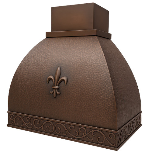 French style copper range hood with fleur de lis emblem angled view, hammered copper canopy with decorative crest and warm aged patina