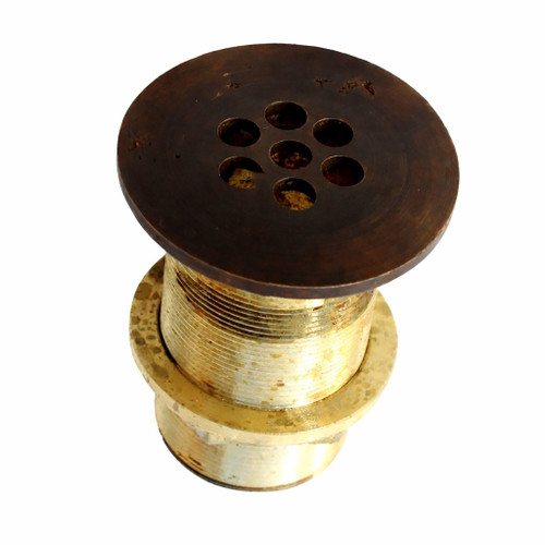 Handcrafted brass sink drain assembly with a dark aged finish