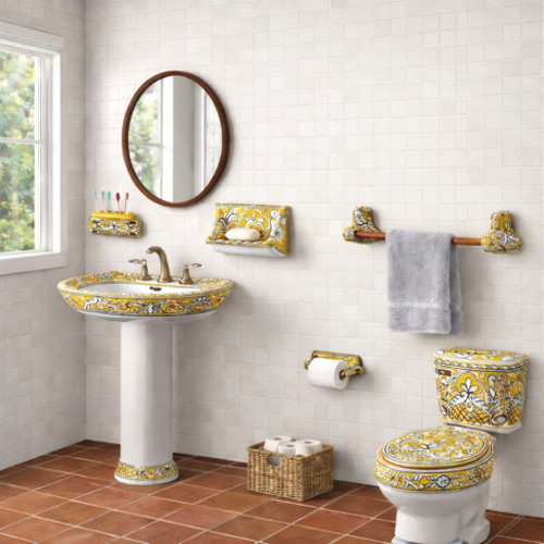 Yellow floral Talavera wall-mount accessory set in a bathroom with hand painted sink and decorated toilet from Mexico