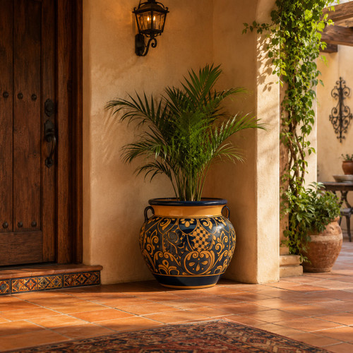 Talavera planter with caramel scrollwork and rolled rim in a hacienda entryway