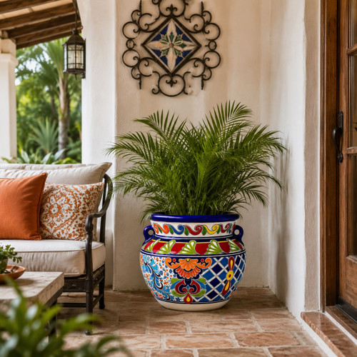 Hand-painted talavera flower planter – traditional Mexican design on a covered porch