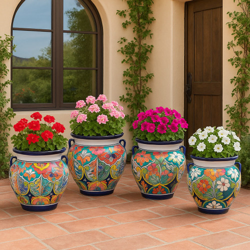Hand-painted Talavera planter with multicolor floral motifs decorating Spanish mission style house patio