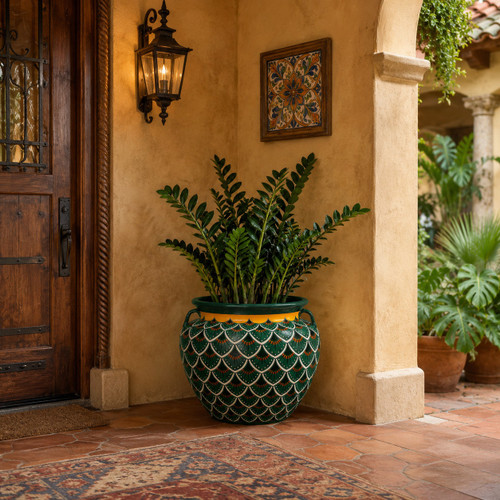 Hand painted talavera planter with green scallop pattern in a warm hacienda entryway