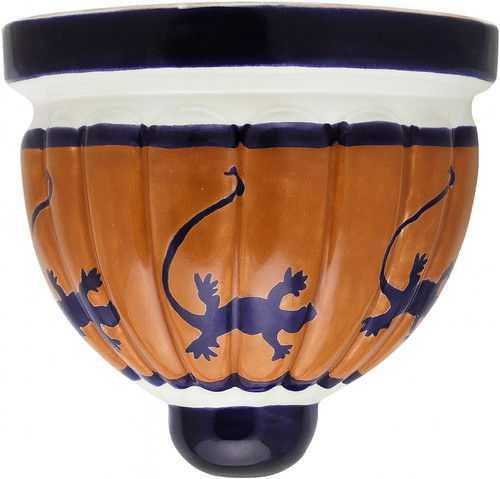 Two Mexican talavera wall sconces with cobalt blue lizard motifs shown on white