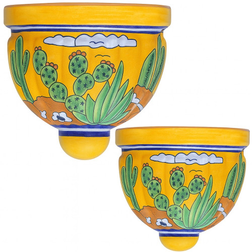 Two Mexican talavera wall sconces with cactus and yellow desert design on white