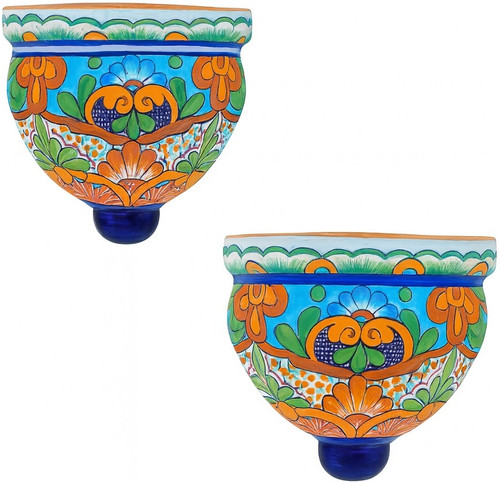 Pair of blue and orange talavera wall sconces shown together on a white background