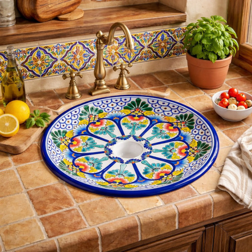 Round talavera bathroom sink blue floral design Mexico styled in a Mediterranean kitchen with tile backsplash and wood accents