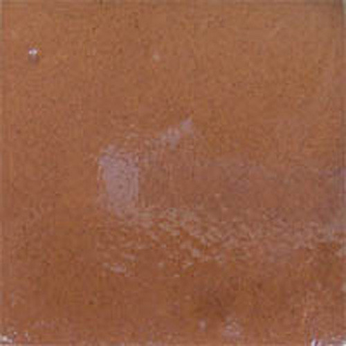 Coffee brown Mexican ceramic tile backsplash with warm handcrafted finish in a rustic kitchen setting