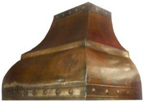 Side view of hammered aged patina copper range hood with flared bell silhouette on white background