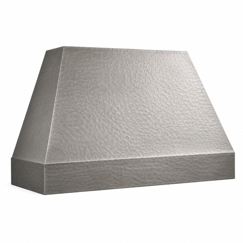 Minimalist hammered zinc range hood angled view showing the tapered canopy and squared apron on white