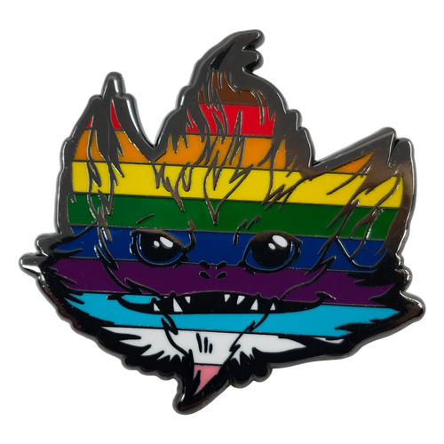 Pride Pin — Skittermander shows a screaming furry long-eared wide-mouthed four-nostriled alien creature’s face, its fur colored in a Pride-themed rainbow.