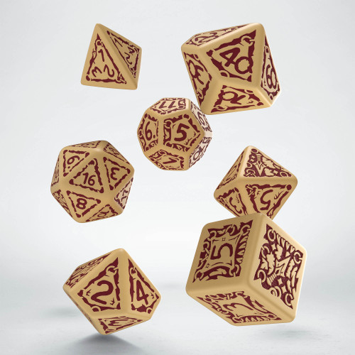 Photo of 7 polyhedral dice in beige with maroon numbers and fantasy embellishments.