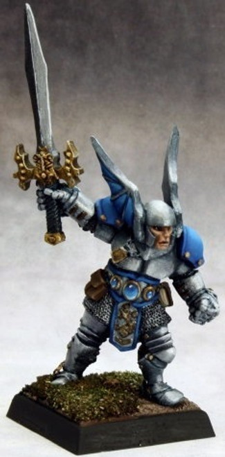 An image of a fully built and painted Vorn, a human paladin, wearing heavy armor and a massively winged helm, holding aloft a sword in the right hand. (Front View)