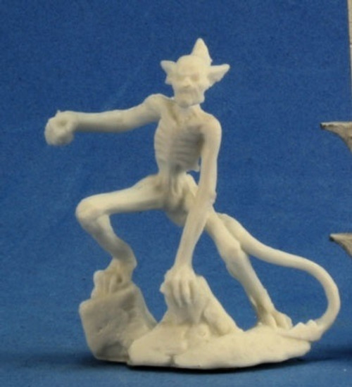 An image of a very skinny Babau Demon perched on some rocks. (Front View)