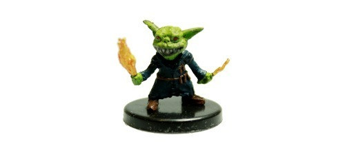 An image of a grinning goblin druid in dark robes. (Front View)