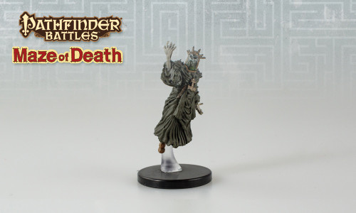 Draped in fine dark robes and a jagged crown, this undead creature’s body seems to be made of equal parts bone and leathery flesh. (Front View)