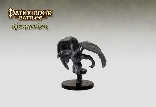 Seemingly carved from a dark gray stone, this sinister humanoid resembles a horned, winged demon in mid-flight. (Front View)