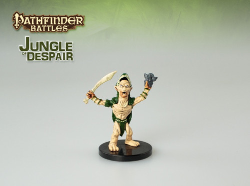 Skin pale as a slug’s belly, eyes huge and bulging, its shape is hideously humanoid. It wears a cloak made of an animal pelt and holds up a sword in one hand and a holy symbol in the other. (Front View)