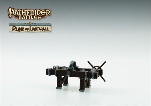 An image of a torturer's table rack covered in chains attached to a handled tightening wheel. (Side View)