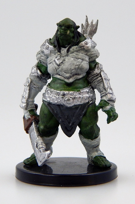 An image of an orc warrior in patchy steel armor, one hand holding a large, wicked blade. (Front View)