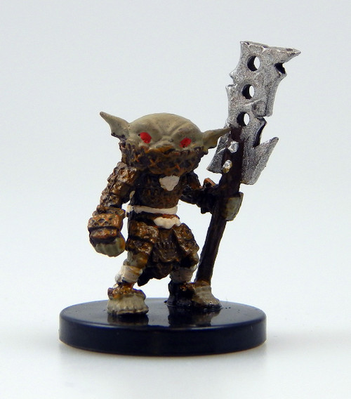 An image of a lightly armored goblin, two bright red eyes showing over the edge of a textured face wrap. In its hand it holds a polearm that looks as if it were constructed by taking the blade of a chopper and tying it to a crude wooden shaft. (Front View)