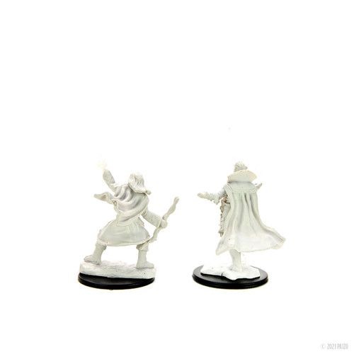 An image of both versions of the included male elf sorcerer. The left version wears comfortable loose robes and boots and holds a wand in the right hand and holds up a handful of magic in the left. The right version holds both hands out with palms up casting magic between them in an arc and directing it forward, his robes billowing around him. (Rear View)