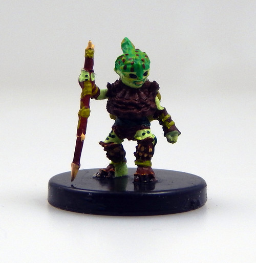 This little, green plant person is clad in a winglike leaf cloak and pinecone armor, wielding a twig as a makeshift spear. (Front View)