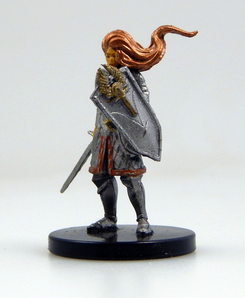 A tall, serene knight with soft golden skin and bright copper hair in full armor, bearing a tower shield on one arm and a sword in the opposite hand. (Front View)