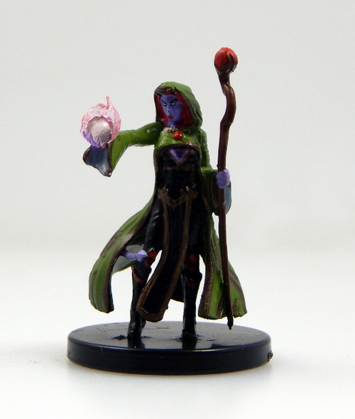 An image of a hellspawn adept with bright purple skin wearing dark robes and a green hooded cloak, holding a tall staff topped with a red orb. One hand holds an orb surrounded by flaming pink energy. (Front View)