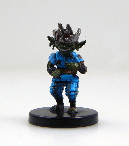 All hail Chief Zusgut, king of Absalom! This widely grinning goblin wears bright blue clothes and a shining, jagged steel crown that looks to be fashioned together out of metal scraps and found materials. (Front View)