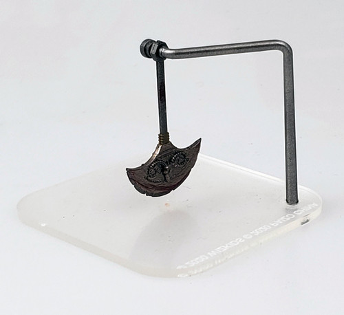 An image of a trap consisting of an oscillating, crescent shaped blade connected to a wide pole. You think you can jump fast enough to get past it, but no, no you can't. (Front View)