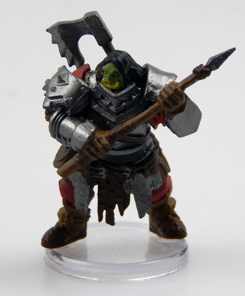 An image of a powerful, broad-shouldered orc heavily armored in gleaming full plate. In their hands they hold a javelin. A viciously toothed, necksplitting axe sits on their back peeking over their shoulder. (Front View)
