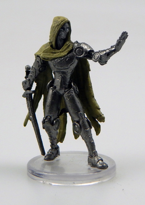 An image of an enforcer archon whose steely body looks like that of a metal construct or automaton. It wears a bone beige cloak with tattered edges. One hand is held up in a pause gesture while the other casually holds a sword. (Front View)