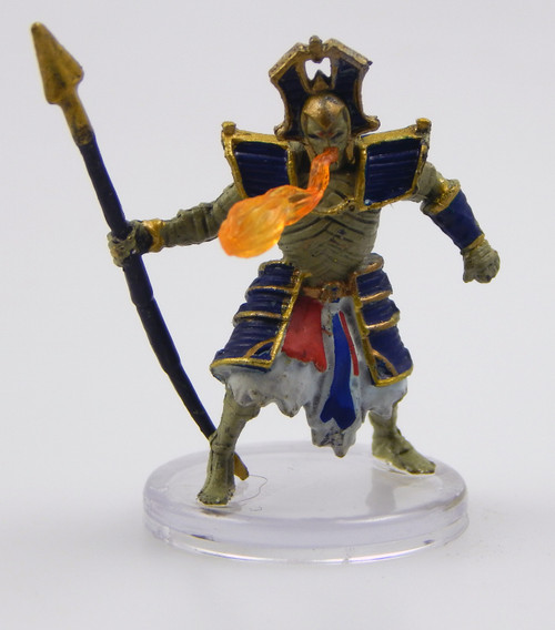 Dirty linen strips swathe this emaciated, once-noble figure from head to toe. Its eyes burn with unholy light. Over its wrappings, this regal mummy reeks of preservative spices and wears the clothing and jewelry of a wealthy pharaoh. In its hand it holds a tall staff while flame shoots from its mouth. (Front View)