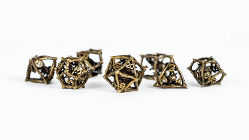 Caged Critters Premium Polyhedral Dice Set product image, showing an array of all 7 metal dice.