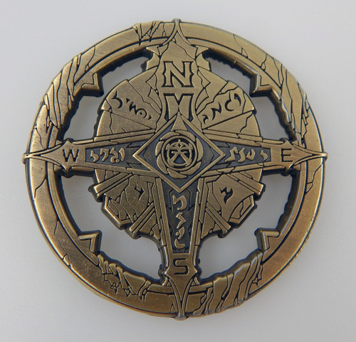 Pathfinder Compass shows a brass-colored compass featuring a four-pointed compass rose.