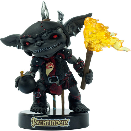 Pathfinder Seventooth Goblin collectible figure, 3.25 inches tall, featuring dark gray and red color scheme. Includes removable base, alternate hands and accessories such as bomb and torch, showcasing goblin tribe's unique appearance and battle-ready design.