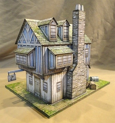 Mermaid Tavern Paper Model PDF, a 28mm scale model requiring 6-7 cardstock sheets, scissors, glue, and a ruler, featuring rustic stone and wood exterior, with multiple texture options, perfect for tabletop gaming or diorama scenes.